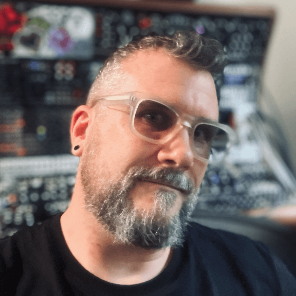 knobulism-jason Jason, sitting in front of their modular synth in their home studio